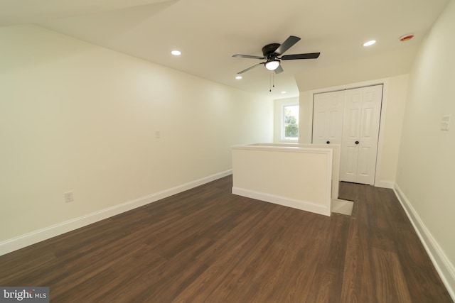 spare room with ceiling fan and dark hardwood / wood-style flooring