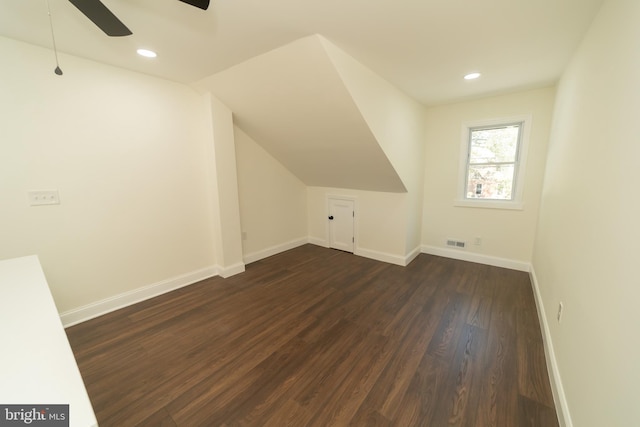 bonus room with dark hardwood / wood-style flooring, ceiling fan, and vaulted ceiling