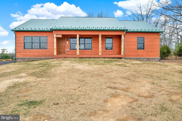 back of house with a yard