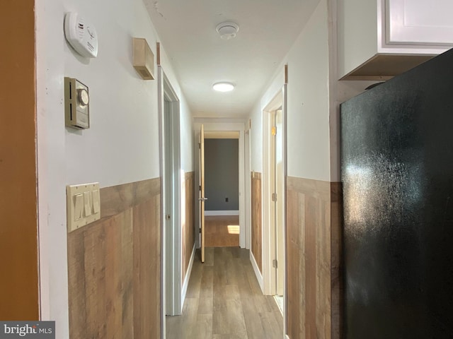 corridor featuring light hardwood / wood-style floors