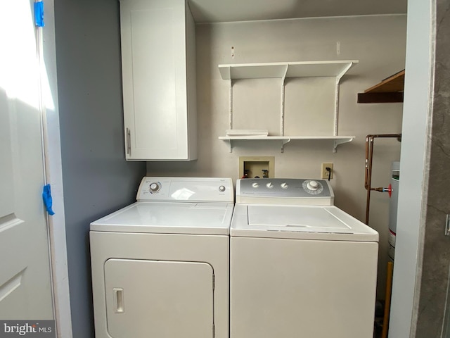 clothes washing area featuring washing machine and dryer