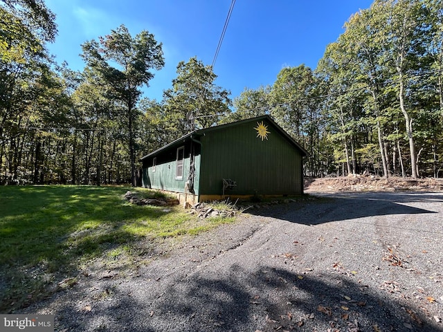 view of property exterior featuring a yard