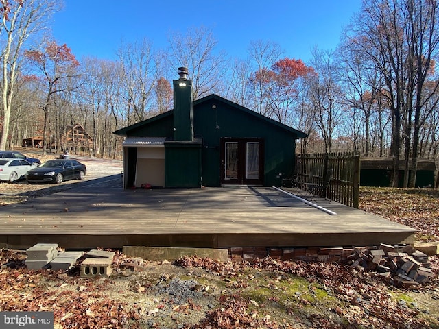 back of house with a wooden deck