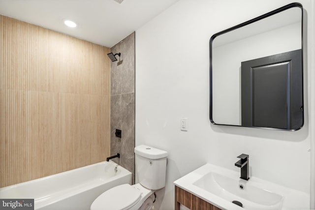 full bathroom with vanity, toilet, and tiled shower / bath