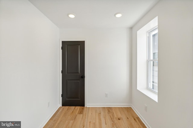 spare room featuring light hardwood / wood-style floors