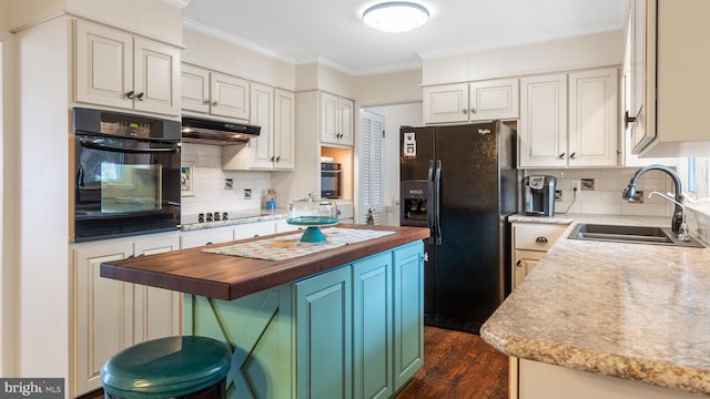 kitchen with butcher block counters, sink, black appliances, a kitchen island, and dark wood-type flooring