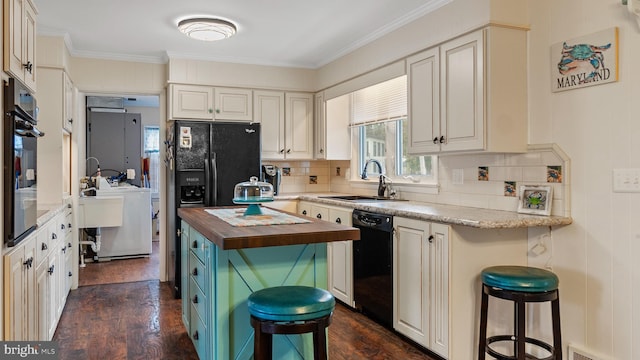 kitchen featuring dark hardwood / wood-style flooring, black dishwasher, sink, ornamental molding, and wood counters