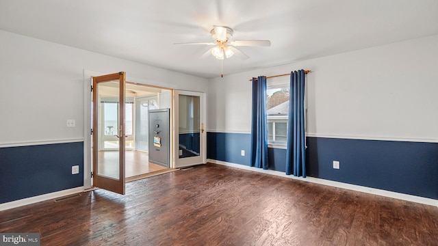 unfurnished room with dark wood-type flooring, a wealth of natural light, french doors, and ceiling fan