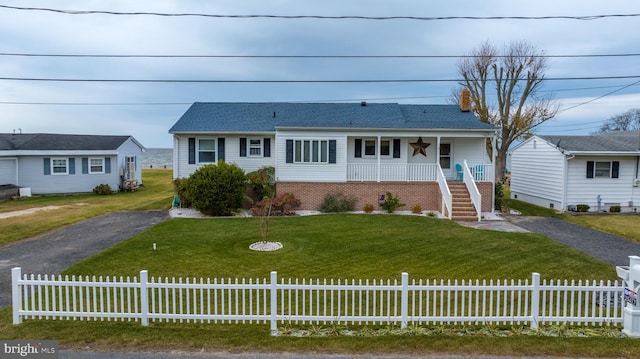 view of front of home with covered porch and a front yard