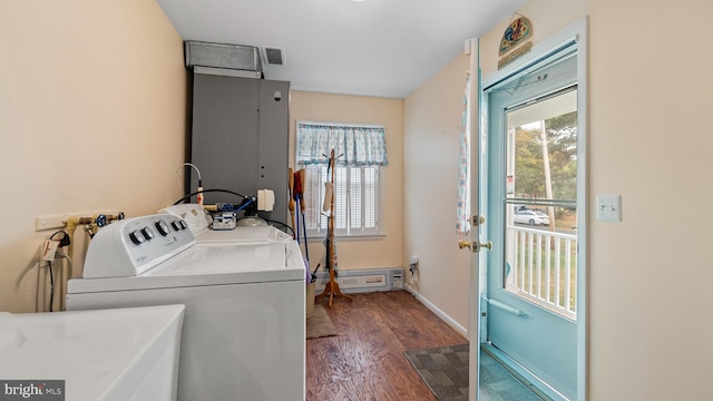 laundry area featuring separate washer and dryer, dark hardwood / wood-style floors, and sink