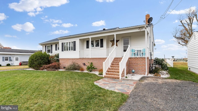 view of front of home with a porch and a front yard