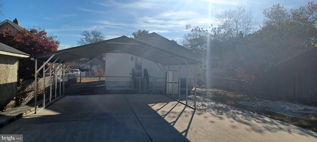 exterior space with a carport