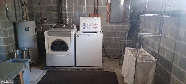 clothes washing area with electric panel, water heater, and independent washer and dryer