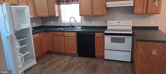 kitchen with dark hardwood / wood-style flooring, white appliances, and sink