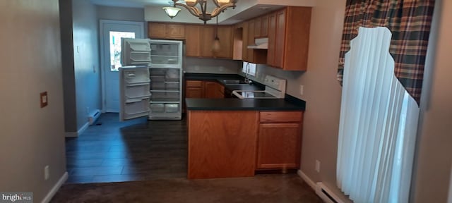 kitchen with dark hardwood / wood-style flooring, white stove, a chandelier, sink, and baseboard heating