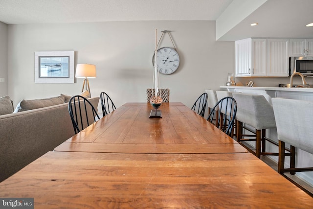 dining area with a textured ceiling