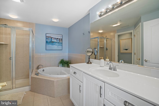 bathroom featuring tile patterned flooring, vanity, and independent shower and bath