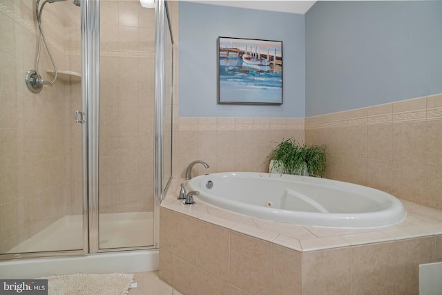 bathroom with shower with separate bathtub