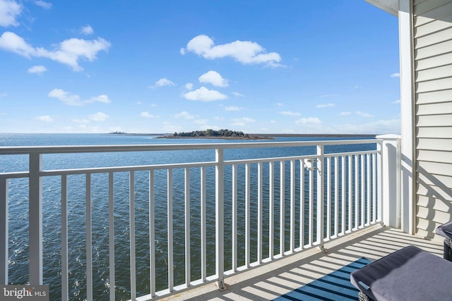 balcony featuring a water view