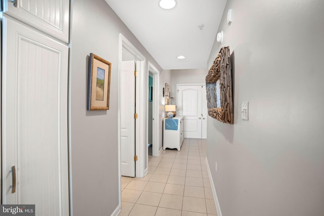 corridor featuring light tile patterned floors