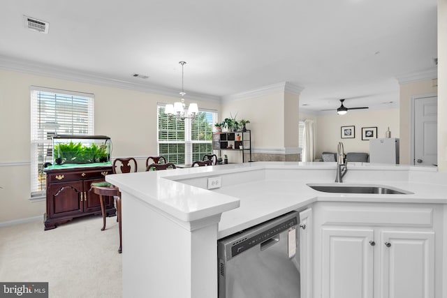 kitchen with light carpet, sink, dishwasher, white cabinetry, and plenty of natural light