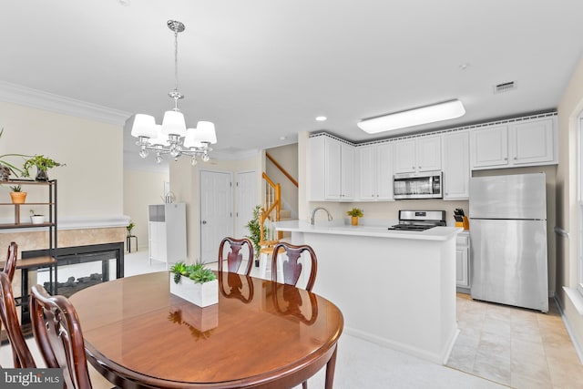 tiled dining area with a notable chandelier and ornamental molding