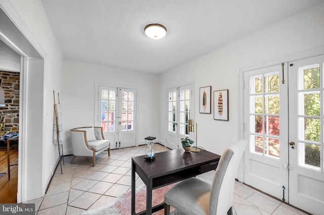 dining area featuring french doors and light tile patterned flooring