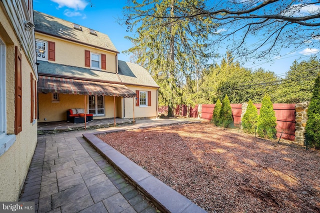 view of yard featuring a patio area and fence