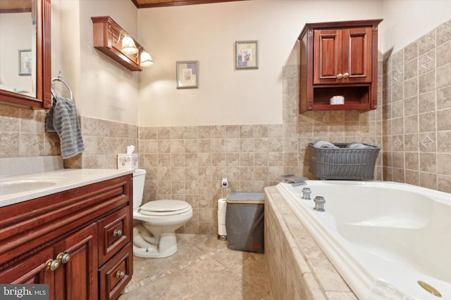 bathroom featuring tile patterned flooring, vanity, toilet, and tile walls