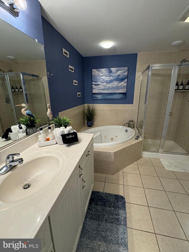 bathroom with vanity, tile patterned floors, and separate shower and tub