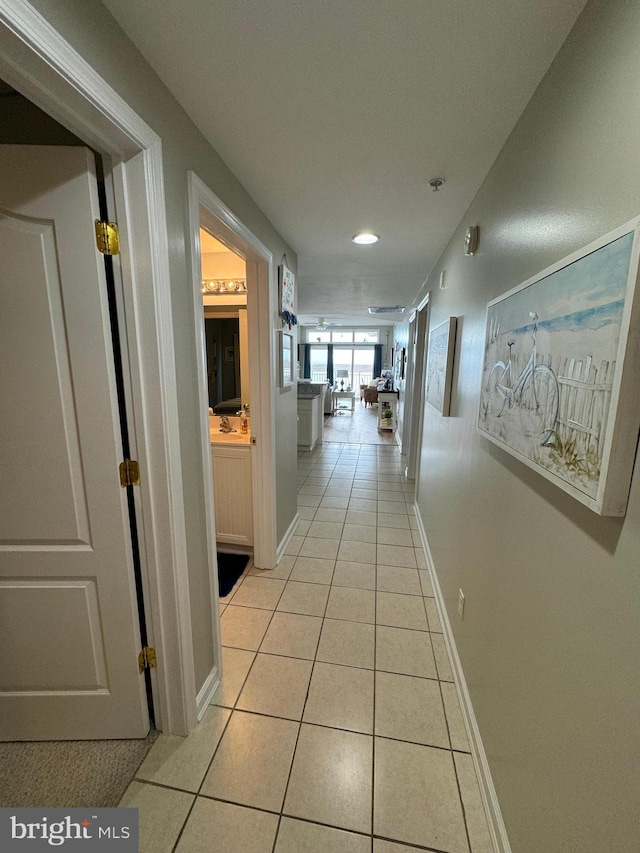 hallway with light tile patterned floors