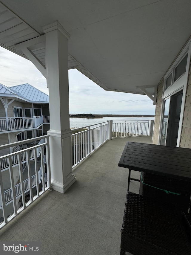 balcony featuring a water view