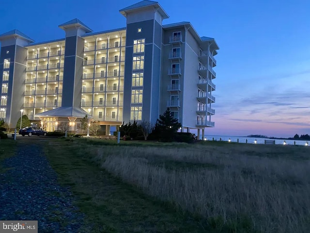 view of outdoor building at dusk