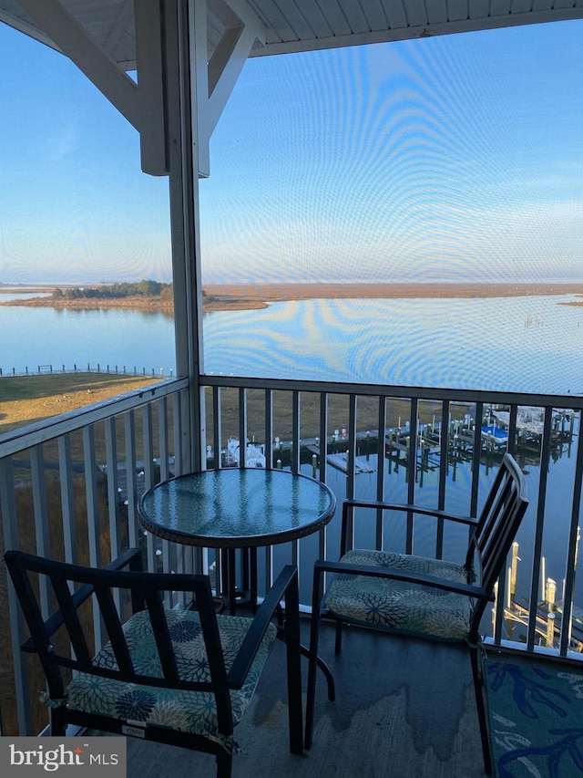 balcony featuring a water view