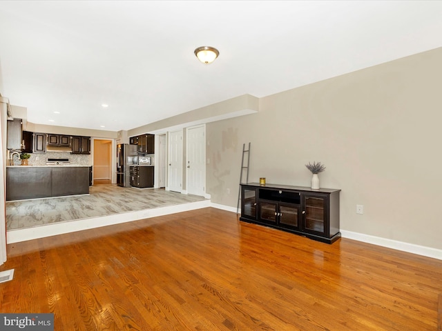 unfurnished living room featuring light wood-type flooring