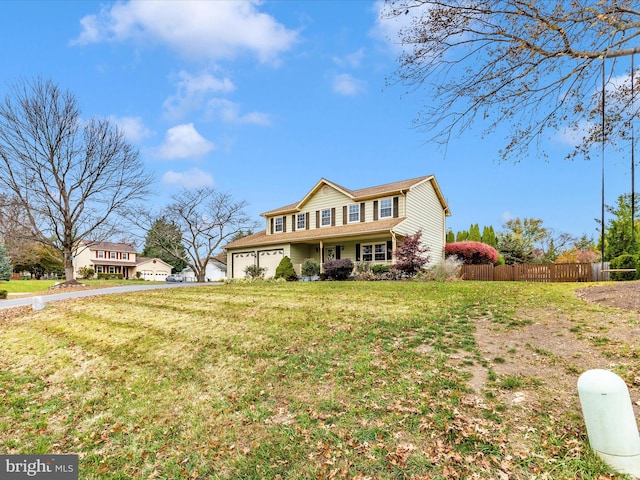 view of front facade featuring a front yard and a garage