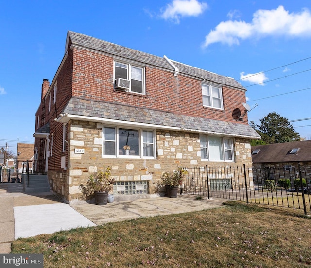 back of property with a patio, a lawn, and cooling unit