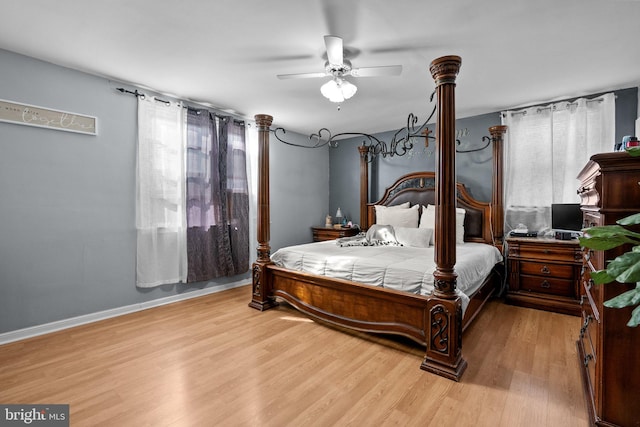 bedroom with ceiling fan and light hardwood / wood-style floors