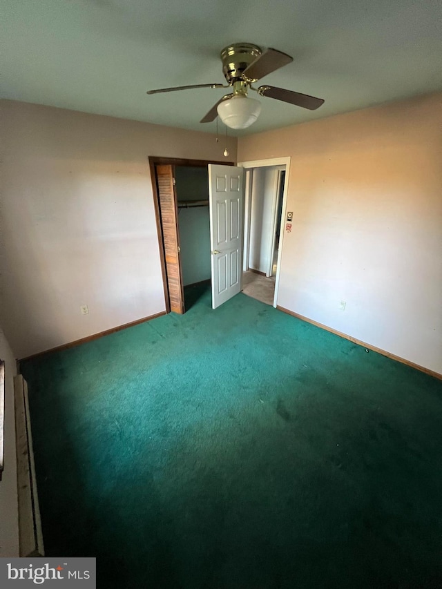 unfurnished bedroom featuring ceiling fan, a closet, and carpet floors