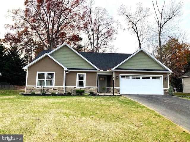 craftsman-style home with a garage and a front yard