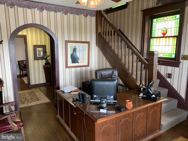 home office with dark wood-type flooring