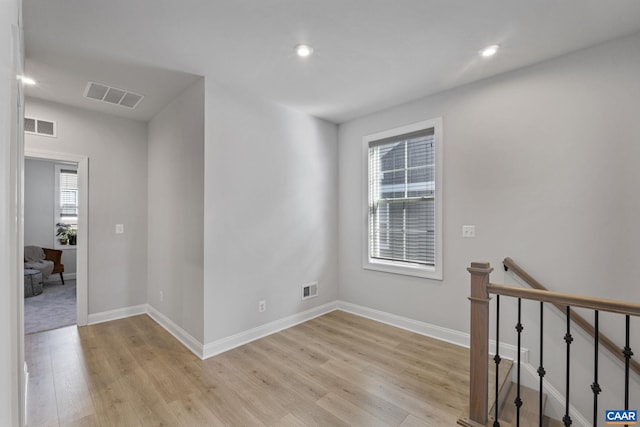 spare room with light wood-type flooring