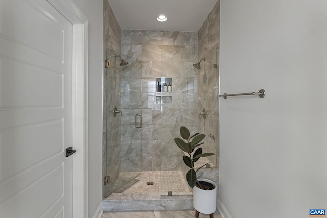 bathroom with a shower with shower door