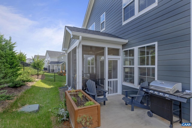 view of patio featuring a sunroom and grilling area