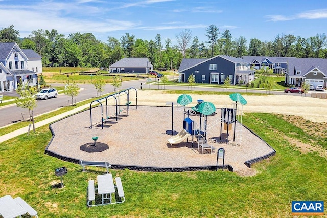 view of jungle gym featuring a lawn