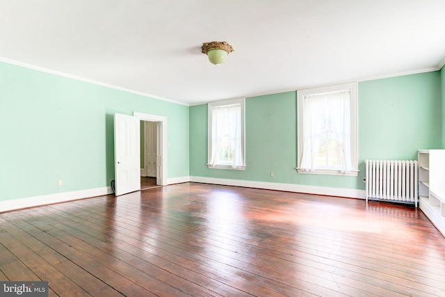 unfurnished bedroom with radiator, dark hardwood / wood-style flooring, and ornamental molding