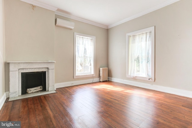 unfurnished living room featuring radiator, ornamental molding, a wall mounted AC, and wood-type flooring