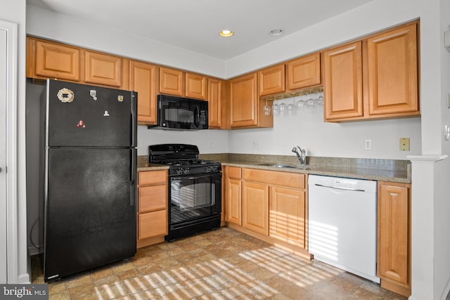 kitchen with sink and black appliances