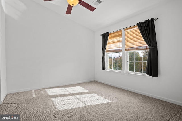 carpeted spare room with ceiling fan