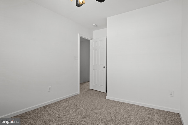 empty room with carpet flooring